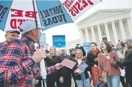  ?? Chip Somodevill­a, Getty Images ?? Protesters on opposing sides of the case of Masterpiec­e Cakeshop vs. Colorado Civil Rights Commission argue Tuesday in front of the Supreme Court building in Washington.