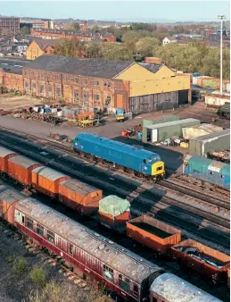  ?? Tom Mcatee ?? A drone image showing the East Lancashire Railway’s Baron Street Locomotive Works from April 24, 2021, shortly after the Peak Locomotive Company’s 45108 had been repainted. The main Locomotive Works building is in need of an extensive refurbishm­ent and the ELR aims to develop the full Buckley Well site to include a steam running shed alongside the main building, as well as workshop and training facilities and a standalone carriage shed.