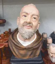  ??  ?? A St. Padre Pio sculpture.