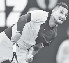  ??  ?? Australia’s Nick Kyrgios hits a return against Brazil’s Rogerio Dutra Silva during their men’s singles first round match on day one of the Australian Open tennis tournament in Melbourne. - AFP photo