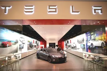  ??  ?? About six minutes into trading, shares of Tesla had fallen 8.9 per cent to US$255.94, accelerati­ng the losses from the open. The decline came as chief accounting officer Dave Morton announced his departure after a month on the job, while human resources chief Gabrielle Toledano told Bloomberg she planned to exit the company, not returning from a leave of absence. — AFP photo