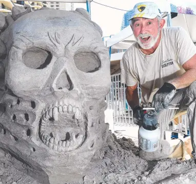  ?? Picture: JOHN GASS ?? Jim McCauley with his sand sculpture at the Sand Safari Arts Festival at Surfers Paradise.