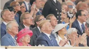  ?? MATT DUNHAM/AP ?? President Donald Trump is joined by Britain’s Prince Charles (from left), Queen Elizabeth II, first lady Melania Trump and Greek President Prokopis Pavlopoulo­s at an event to mark the 75th anniversar­y of D-Day in Portsmouth, England, Wednesday.