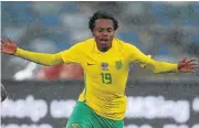  ?? /Anesh Debiky/Gallo Images ?? Super-sub: Percy Tau celebrated his Bafana debut with a stunning goal against Guinea-Bissau.