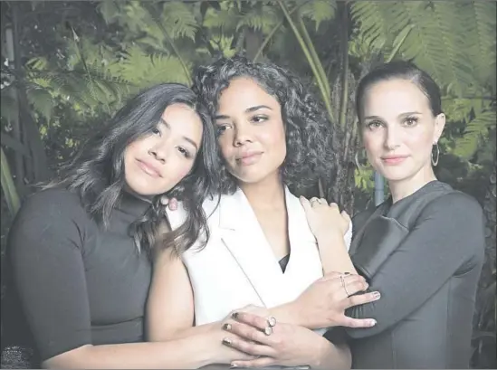  ?? Allen J. Schaben Los Angeles Times ?? GINA RODRIGUEZ, left, Tessa Thompson and Natalie Portman renewed the on-set camaraderi­e of 2016 as founding signatorie­s of the Time’s Up movement.