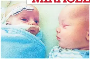  ??  ?? Sick Roman in hospital cot with his twin brother Hunter LIFE-SAVER