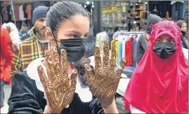  ?? ANI ?? A girl shows her hand decorated with henna ahead of Eid-ul-Fitr in Srinagar on Thursday.