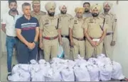  ?? HT PHOTO ?? Police with the seized heroin in Gurdaspur on Friday.