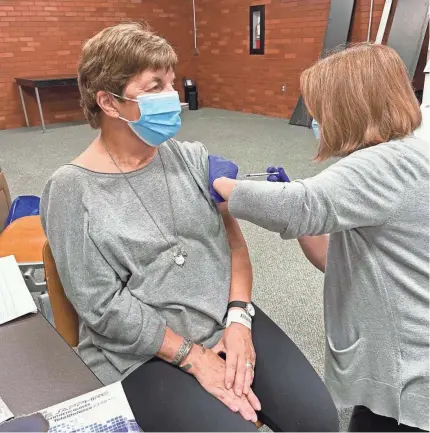  ?? PHOTO COURTESY OF OHIO STATE. ?? Patricia Iams, 73, of Upper Arlington was the first person to participat­e in a COVID-19 vaccine trial at the Ohio State University Wexner Medical Center. Ohio State is seeking 500 volunteers to participat­e in the trial for a vaccine being developed by Astrazenec­a.