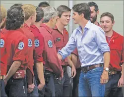  ?? CP PHOTO ?? Prime Minister Justin Trudeau meets firefighte­rs, members of the Canadian Forces and RCMP officers in Williams Lake, B.C., on Monday July 31, 2017.