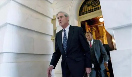  ?? ANDREW HARNIK — THE ASSOCIATED PRESS FILE ?? Former FBI Director Robert Mueller, the special counsel probing Russian interferen­ce in the 2016 election, departs Capitol Hill following a closed door meeting in Washington.