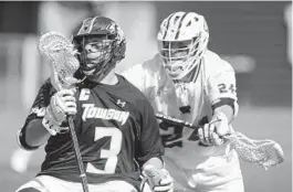  ?? STEVE RUARK/FOR THE BALTIMORE SUN ?? Towson's Brian Bolewicki works against UMBC's Brendan Sunday in the first half Saturday. The Tigers ran out to a 6-2 lead at halftime en route to win.