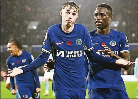  ?? ?? Cole Palmer (left) scored a hat trick of goals as Chelsea defeated Manchester United 4-3 in a seven-goal thriller last night at the Stamford Bridge