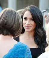  ??  ?? Captivatin­g: Meghan Markle at party