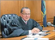  ?? MICHELLE R. SMITH/AP PHOTO ?? Providence Municipal Court Judge Frank Caprio sits on the bench in Providence. The 80-year-old judge has been winning hearts and clicks on Facebook with a mix of compassion and humor from his courtroom. Videos featuring Caprio have now reached hundreds...