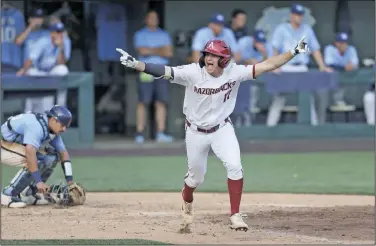  ?? Charlie Kaijo/NWA Democrat-Gazette ?? Celebratin­g: Arkansas’ Brady Slavens (17) celebrates, Sunday, June 12, 2022, at the end of the ninth inning during the NCAA Baseball Super Regional Game 2 at Boshamer Stadium in Chapel Hill, N.C.