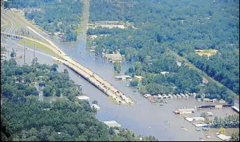  ?? AFP ?? A road is covered by floodwater­s left in the wake of Hurricane Harvey near Houston, Texas.