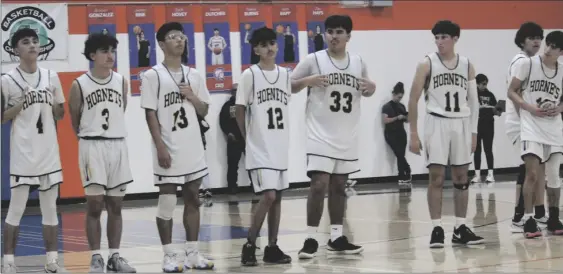  ?? PHOTO RUSSELL SOLIMINE ?? The Calipatria Hornets line up to receive recognitio­n following Calipatria’s defeat in the CIF Division V championsh­ip game to Del Lago High in San Diego Thursday night.