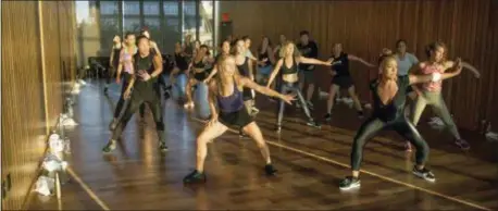  ?? GABRIEL EUGENE — NICOLE WINHOFFER VIA AP ?? In this photo, Nicole Winhoffer, front right, teaches her NWMethod fitness class at The Standard Hotel in New York. Loved by Madonna and Kate Hudson, Winhoffer mixes dance cardio and strength training. Her workout NW Church gives you access to the...