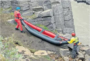  ?? ?? In their element: in Welcome to Earth, Dwayne and Will prep a ‘rubber floaty’ kayak for their challengin­g river journey