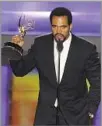  ?? Matt Sayles Associated Press ?? AWARD WINNER Kristoff St. John accepts a Daytime Emmy in 2008.