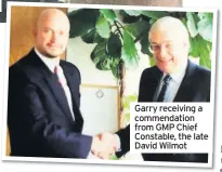  ??  ?? Garry receiving a commendati­on from GMP Chief Constable, the late David Wilmot