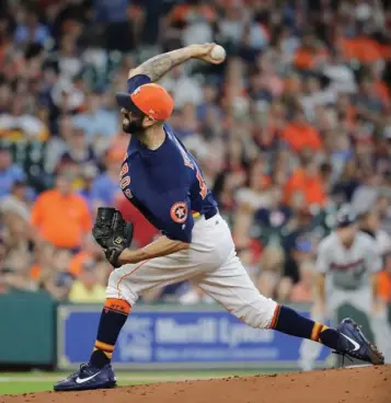  ?? Associated Press ?? n Houston Astros starting pitcher Mike Fiers throws against the Minnesota Twins during the first inning of a baseball game Sunday in Houston.