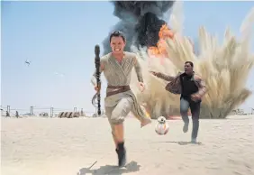  ??  ?? Daisey Ridley and John Boyega in Star Wars: The Force Awakens.