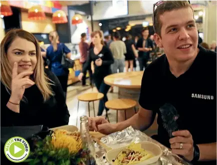  ?? PHOTO: WARWICK SMITH/FAIRFAX NZ ?? Jacob Mcdonald tries the new tastes on offer at Downtown’s revamped food court. He says he’ll be back.