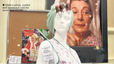 ??  ?? Hilda’s pinny, curlers and headscarf sold for more than £4,000