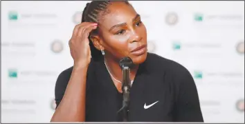  ?? — AFP ?? DOWN AND OUT . . . Former world number one Serena Williams announces her decision to pull out of the French Open at a media conference in Paris yesterday.