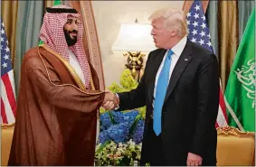  ?? EVAN VUCCI/AP PHOTO ?? President Donald Trump shakes hands Saturday with Saudi Deputy Crown Prince and Defense Minister Mohammed bin Salman during a meeting in Riyadh.