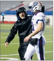  ?? Arkansas Democrat-Gazette File Photo ?? Arkadelphi­a coach J.R. Eldridge congratula­tes quarterbac­k Cannon Turner on Dec. 8 during the Class 4A state championsh­ip game against Joe T. Robinson at War Memorial Stadium in Little Rock.