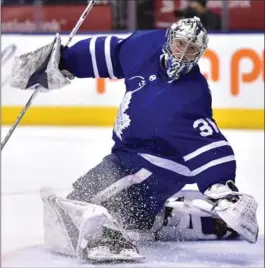  ?? FRANK GUNN, THE CANADIAN PRESS ?? Maple Leafs goaltender Frederik Andersen watches the puck as he looks over his shoulder in the third period against the Ottawa Senators at Air Canada Centre in Toronto on Wednesday. Andersen made 29 saves on the night, but couldn’t stop Ottawa from...