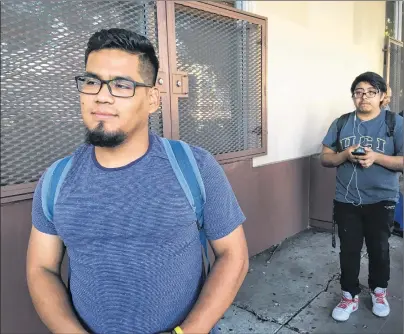  ?? AMY TAXIN/AP PHOTO ?? Oscar Gaytan waits in line to renew his work permit under an expiring Obama-era program for immigrants brought to the country as children. After Oct. 5, 2017, no one else can renew under the program that has let nearly 800,000 immigrants brought to the United States as children work in the country even though they lack legal papers.