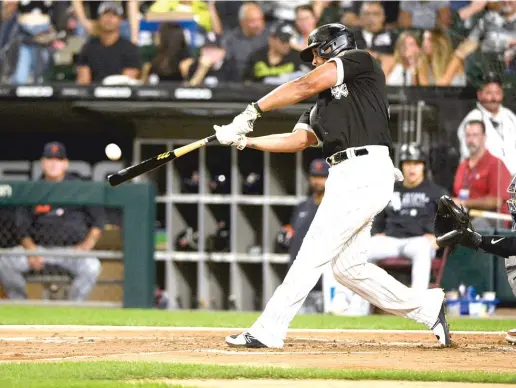  ?? MATT MARTON/AP ?? Jose Abreu, leader of the Sox’ old guard, hits a home run in the third inning of an 8-1 win over the Tigers on Friday night, giving him 30 homers for the season.