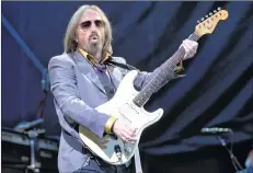  ??  ?? Tom Petty performs with the Heartbreak­ers during their headlining set on Day 1 of the inaugural 2017 Arroyo Seco Music Festival, in Pasadena, Calif.