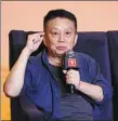  ?? PHOTOS PROVIDED TO CHINA DAILY ?? Director Huang Jianxin speaks about the production of the film,
(top), which opened the Shanghai Internatio­nal Film Festival.