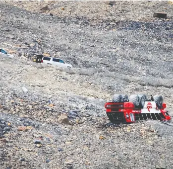  ?? JEFF MCINTOSH/THE CANADIAN PRESS ?? Three people were killed and 14 others suffered life-threatenin­g injuries when a bus carrying tourists to a glacier rolled over at the Columbia Icefield near Jasper, Alta., on Saturday.