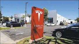  ?? Allen J. Schaben Los Angeles Times ?? TESLA delivered a record 95,200 cars in the second quarter, led by its Model 3.