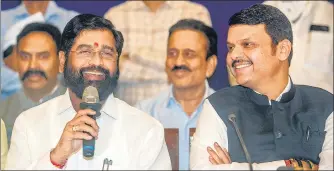  ?? SATISH BATE/HT PHOTO ?? Chief minister Eknath Shinde and deputy chief minister Devendra Fadnavis interact with the media before the swearing-in ceremony at Raj Bhavan on Thursday.