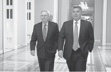  ?? CLIFF OWEN, AP ?? Republican Sens. Mitch McConnell and Cory Gardner walk to the Senate chamber Thursday.