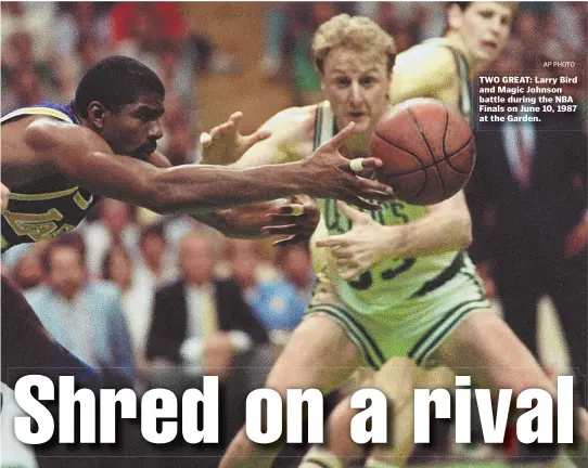  ?? AP PHOTO ?? TWO GREAT: Larry Bird and Magic Johnson battle during the NBA Finals on June 10, 1987 at the Garden.