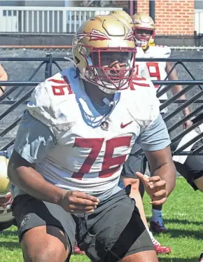  ?? ?? Florida State football players take part in drills during FSU final spring practice on April 17.