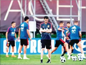  ?? PIERRE-PHILIPPE MARCOU/AFP ?? The new coach of the Spanish national football team, Fernando Hierro (centre), attends a training session at Krasnodar Academy on Wednesday.