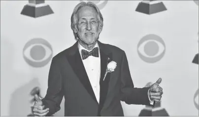  ?? AP PHOTO ?? In this Jan. 28 file photo, president of The Recording Academy Neil Portnow poses in the press room at the 60th annual Grammy Awards in New York. The Recording Academy is reassuring its members that they are not behind the music industry when it comes...