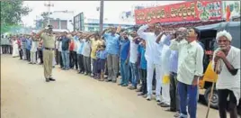  ?? HT PHOTO ?? Residents of Jammikunta town in Telangana’s Karimnagar district stop whatever they are doing as soon as loudspeake­rs come to life at 7.58am, telling them the anthem is about to begin in two minutes.