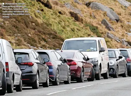  ?? ?? Hundreds of vehicles were parking illegally on Pen y Pass, Snowdon, until curbs were introduced. But managing the problem costs money.