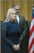  ?? DENNIS M. RIVERA PICHARDO — THE ASSOCIATED PRESS ?? Justice Secretary Wanda Vazquez is accompanie­d by her husband, Judge Jorge Diaz, during her swearing in ceremony as Puerto Rico’s new governor Wednesday in San Juan, Puerto Rico.