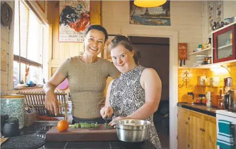  ?? Picture: SAM ROSEWARNE ?? CARING: Independen­t disability support worker Kim Wellspring, left, with client Annalise Haigh, 20.